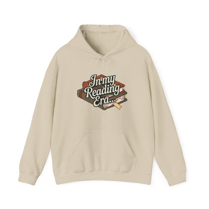 Beige hoodie with 'In my Reading Era' text and book graphic on a white background